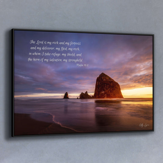 Christian coastal wall art of Haystack Rock at sunset with Psalm 18:2 — “The Lord is my rock and my fortress.”
