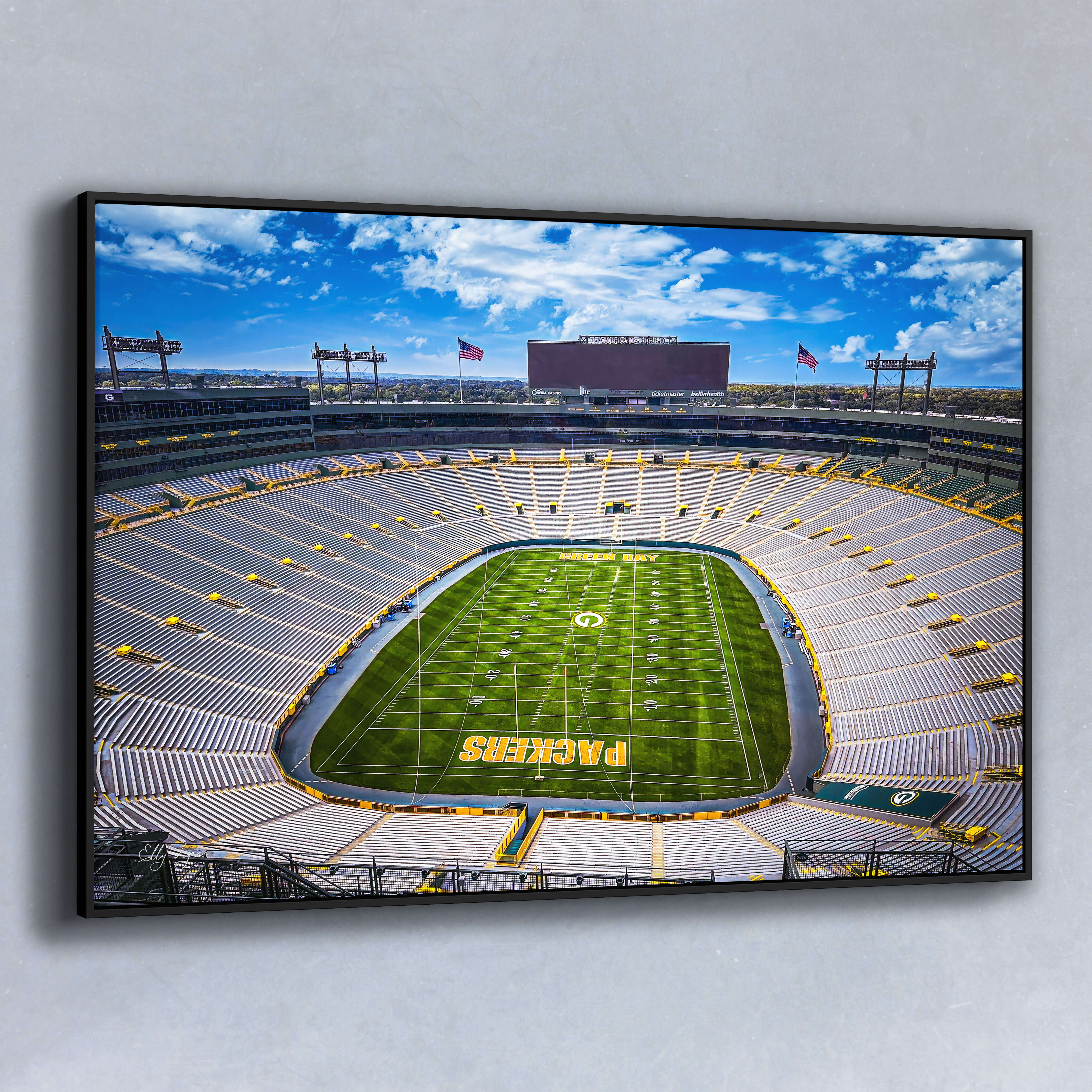 Aerial fine art photo of Lambeau Field, home of the Green Bay Packers, with an empty stadium and vivid blue sky.