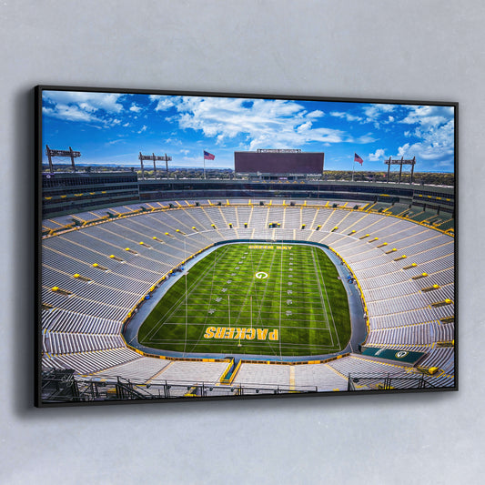 Aerial fine art photo of Lambeau Field, home of the Green Bay Packers, with an empty stadium and vivid blue sky.