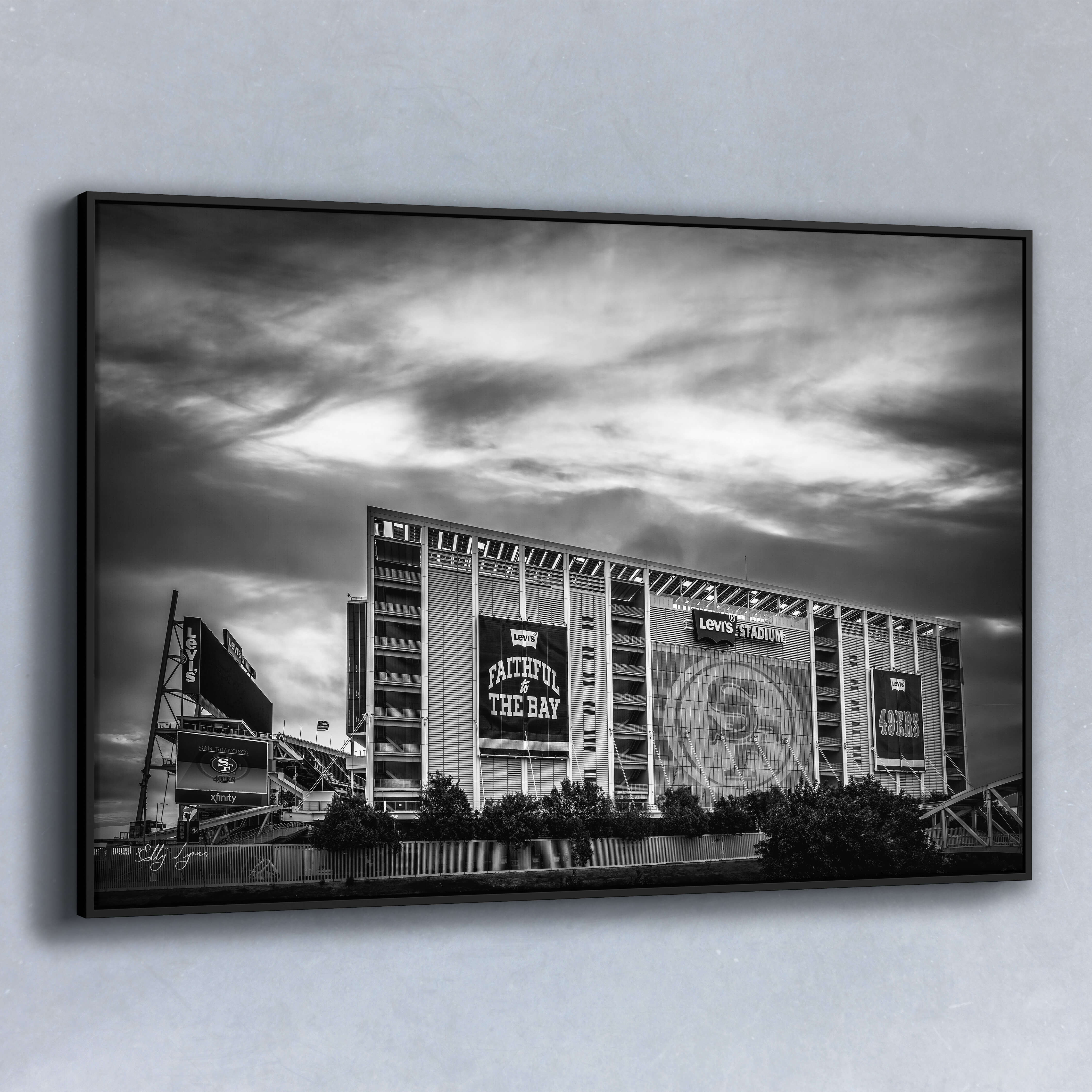 Black and white fine art photo of Levi’s Stadium at sunset, with dramatic sky above and banners reading “Faithful to the Bay” and “49ers,” ideal for fans and collectors.