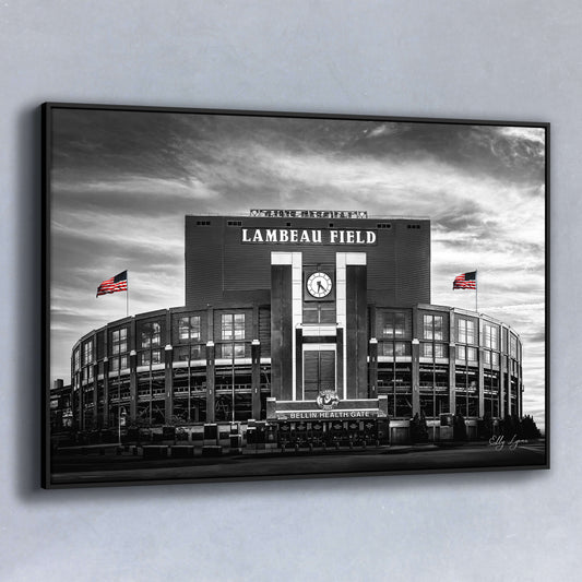 Main Image – Black and white fine art photo of Lambeau Field with two American flags in full color, capturing drama and history in one iconic scene.