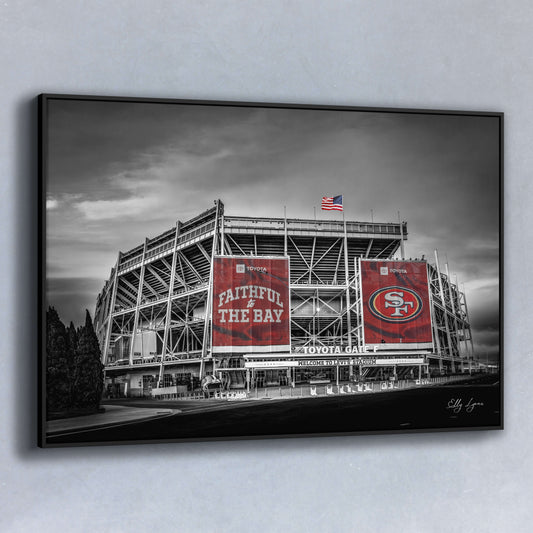 Black and white fine art print of Levi’s Stadium with vivid red “Faithful to the Bay” and 49ers banners standing out in bold contrast.