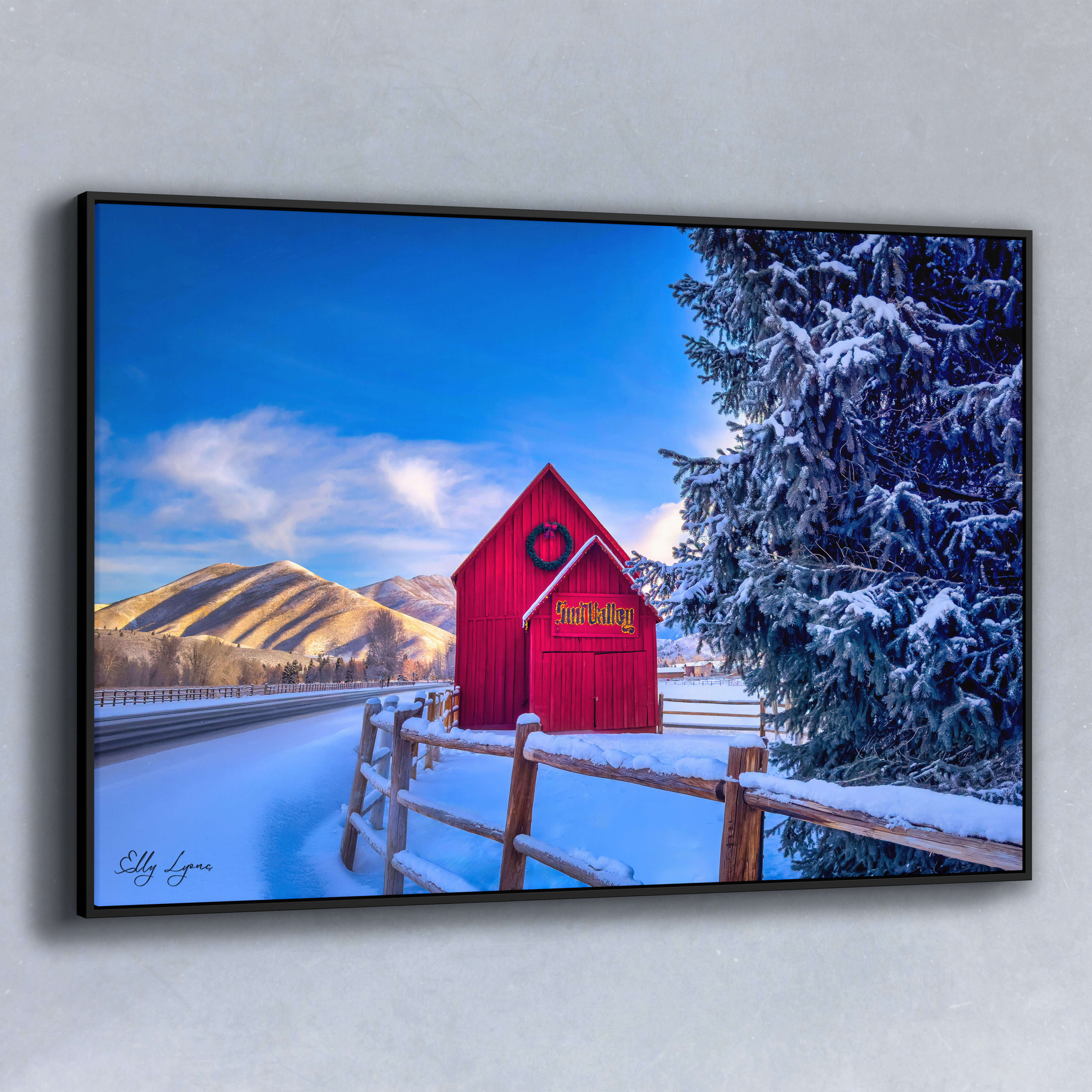 Fine art winter landscape of the iconic red Sun Valley barn in Idaho, nestled under snowy mountains and blue sky – premium photography wall art print.