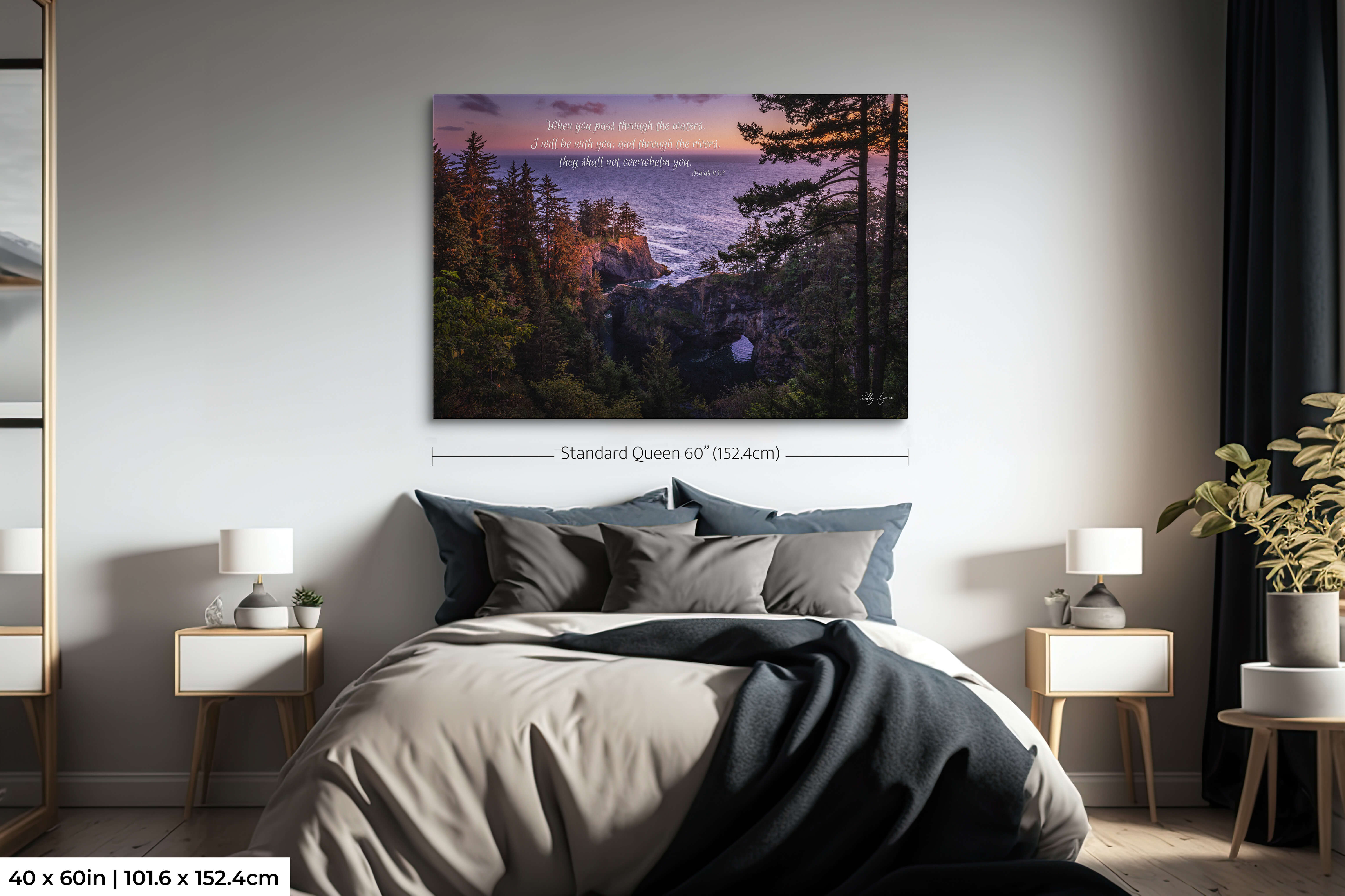 Oversized scripture wall art of coastal cliff scene with Isaiah 43:2 promise in spacious bedroom.