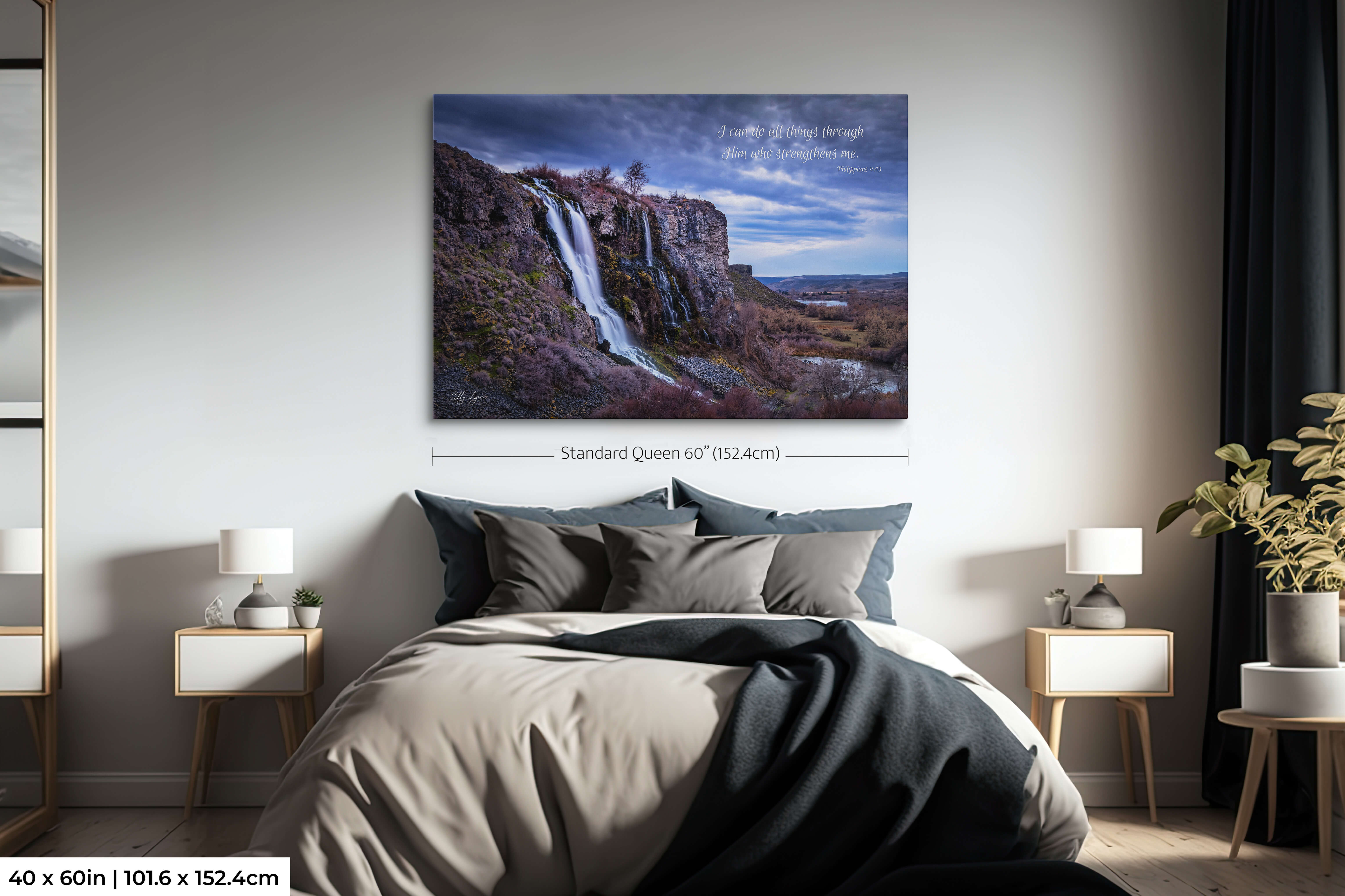 Oversized Christian wall art print of a bold waterfall and Philippians 4:13, styled above a king bed for dramatic impact.