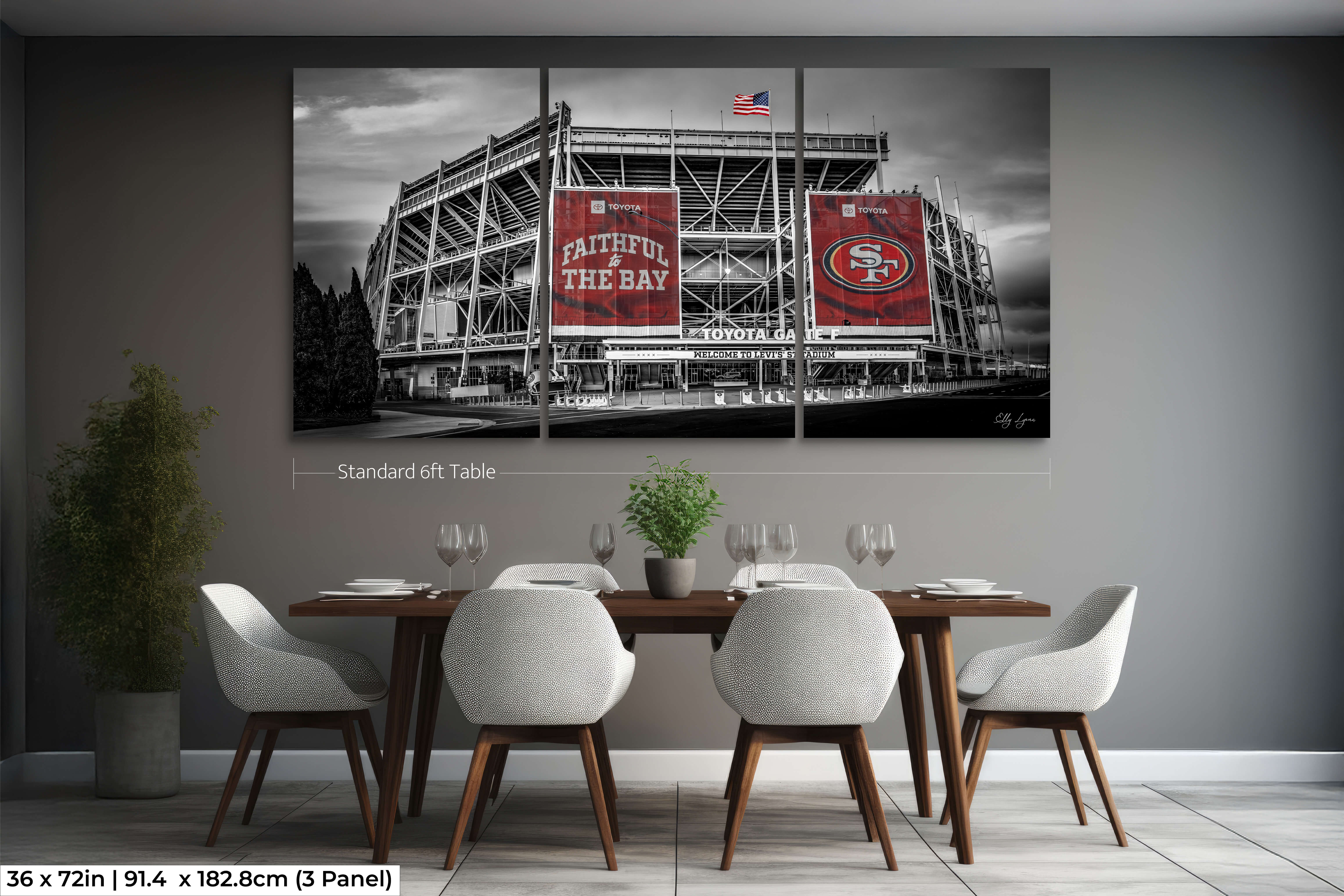 Extra-wide 36x72 triptych of Levi’s Stadium in black and white with red highlights, styled in a dining room above a 6ft table.