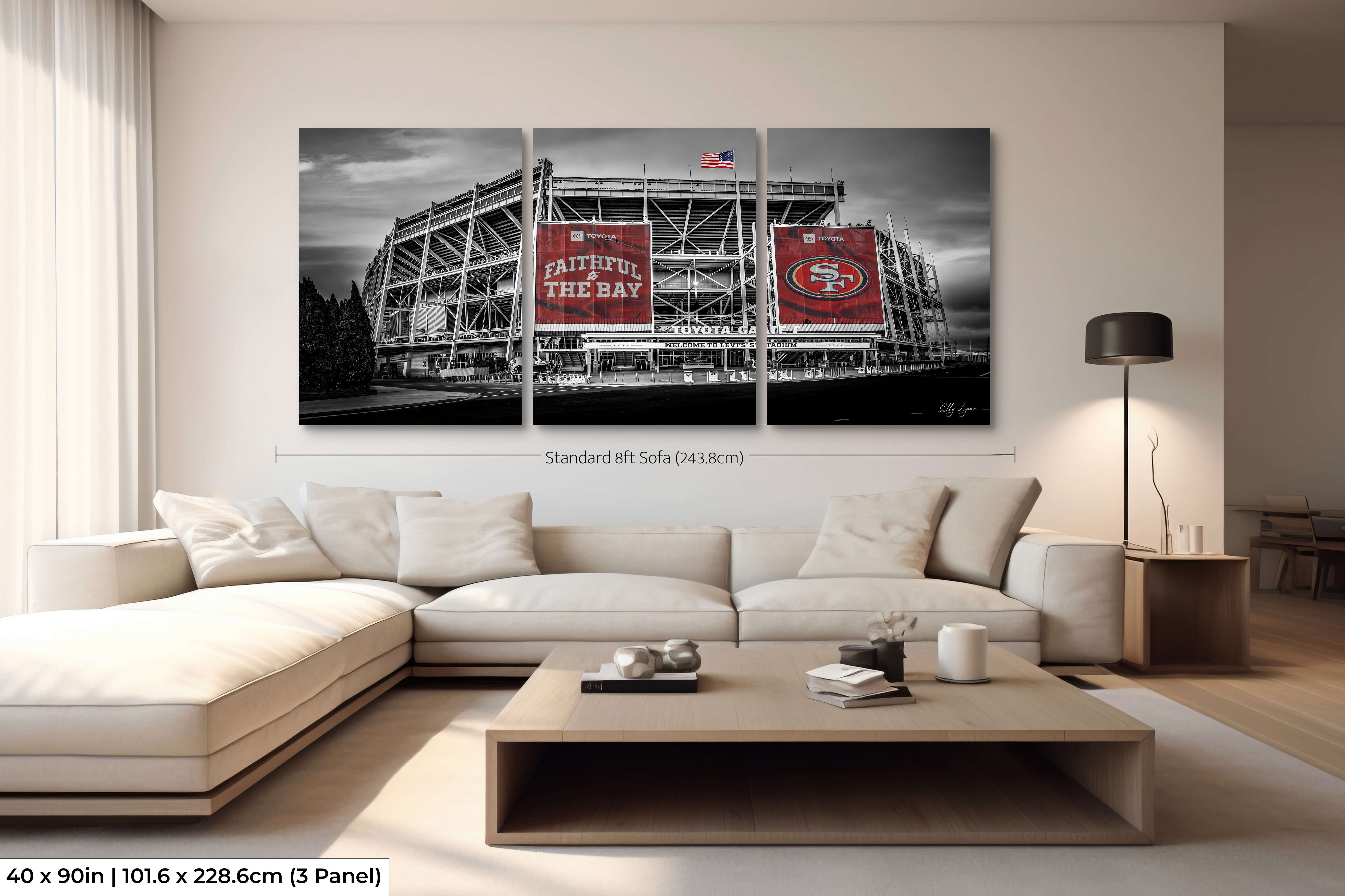 Extra-large 40x90 three-panel Levi’s Stadium print in black and white with red banners, mounted above an 8ft couch for dramatic impact.