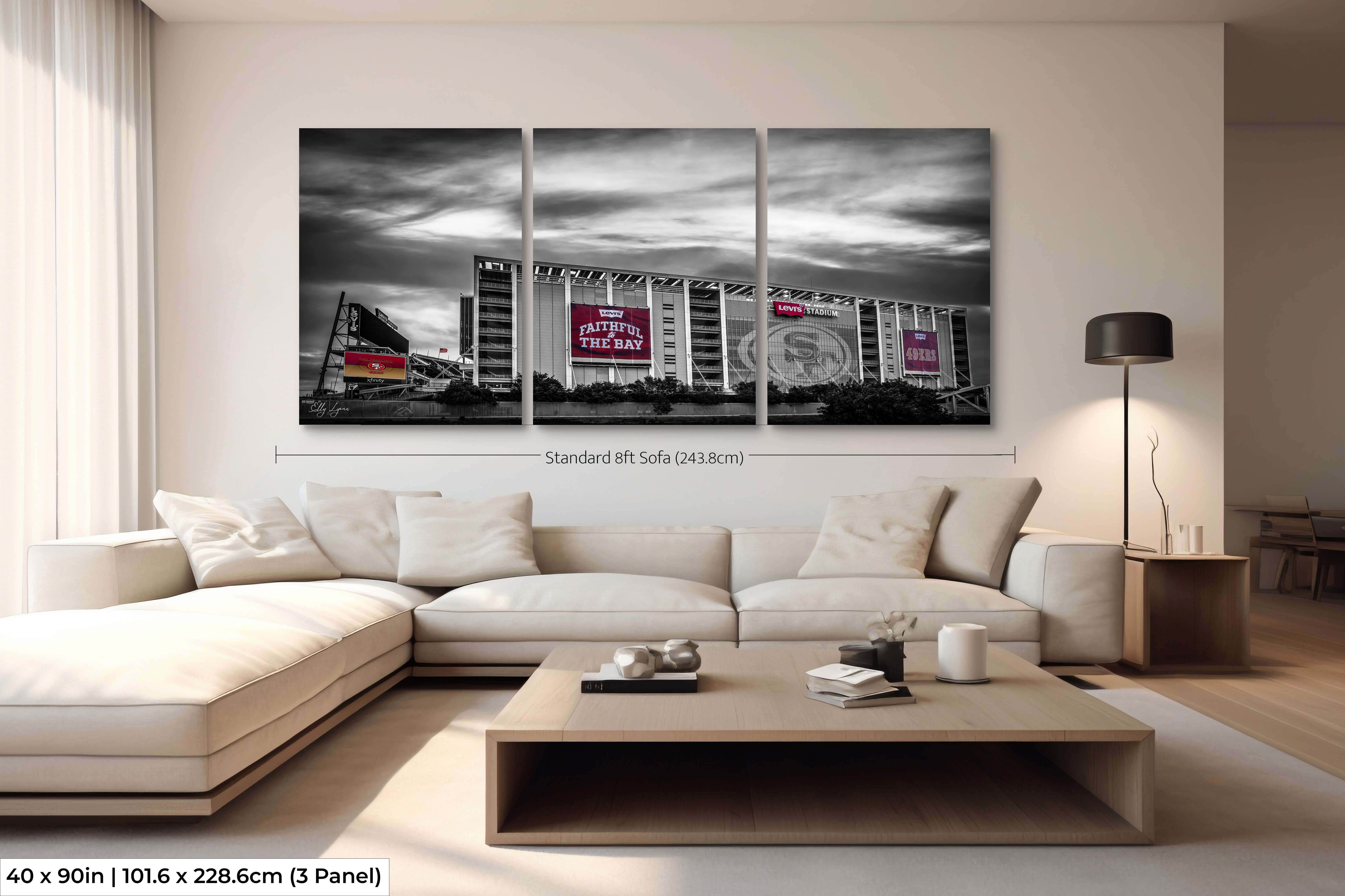 Panoramic 40x90 three-panel Levi’s Stadium color splash print arranged above an 8ft sectional sofa, showing ideal proportions for large living rooms.